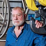 West Oakland-based sculptor Bruce Beasley poses for a photo with one of his Stainless steal ringed sculptures in the future Bruce Beasley...