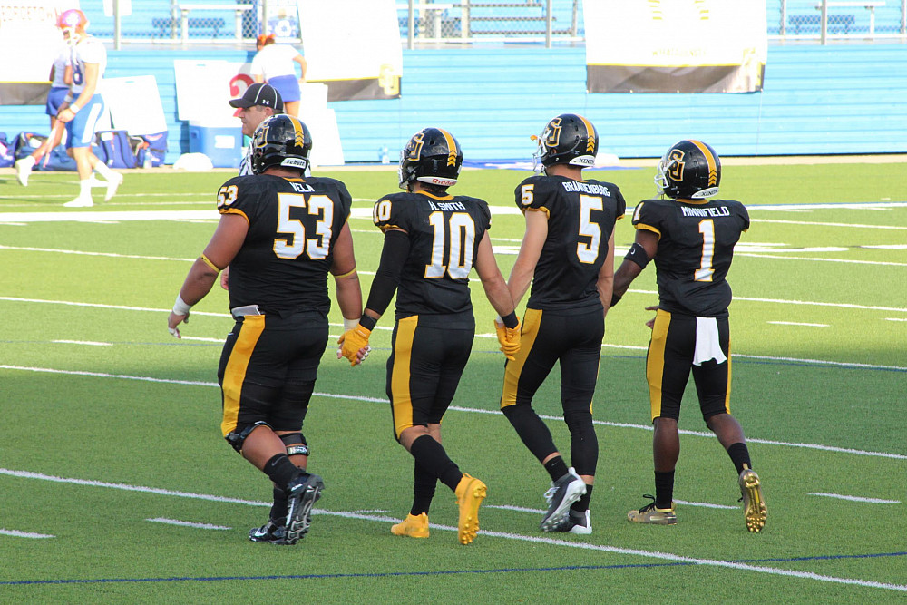 Vela and the other football team captains. 