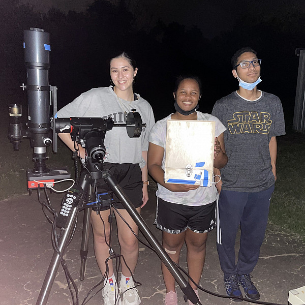 Physics majors Emily Ely ’22, Johnna Campbell ’24, and Sameer Rai ’22 in the field during their summer research.