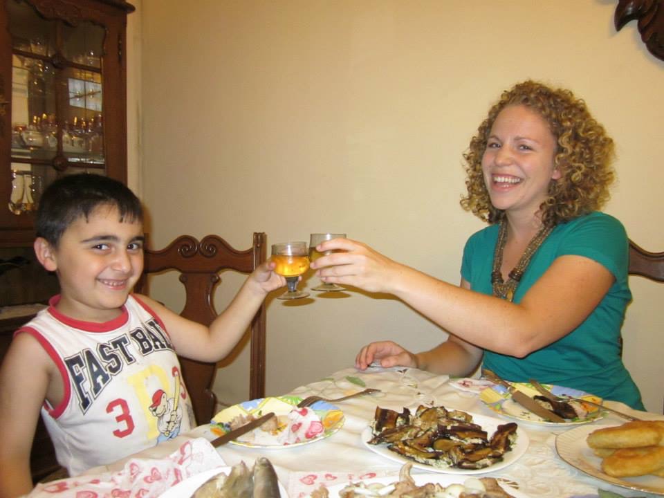 Ellermann toasting her host cousin, Besiki, at a Supra (a feast) her host family prepared for Ell...