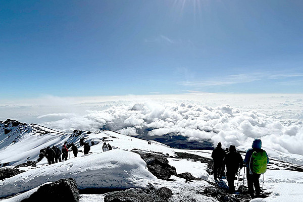 Southwestern students atop Mount Kilimanjaro (photo by Thira Schlegel ’24)